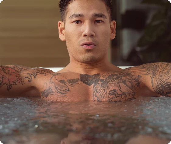 man submerged in the tub