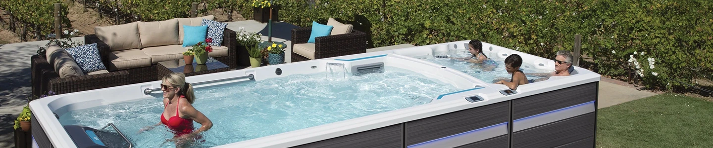 Dual-temperature Endless Pools swim spa with separate hot tub and swim zones