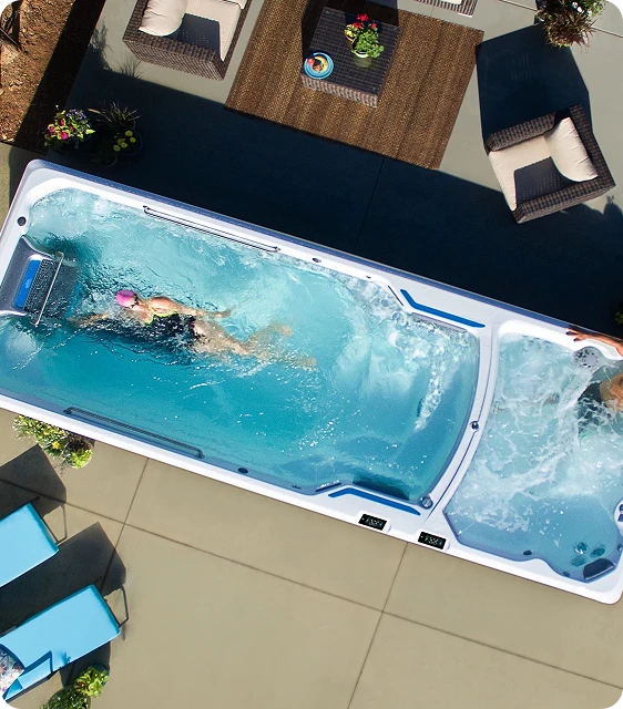 Dual-temperature swim spa installation pad electrical and delivery footprint