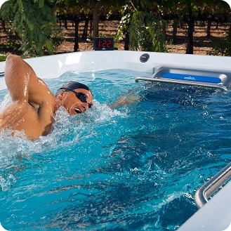 Dual-temperature swim spa swim zone for lap training and aquatic fitness