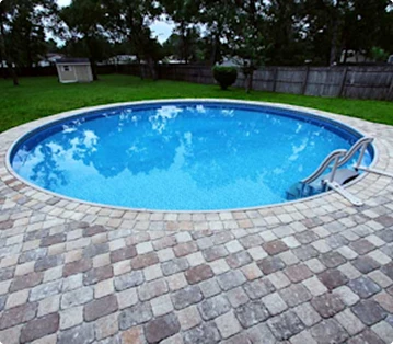 Semi-Inground Pool with paver patio surround