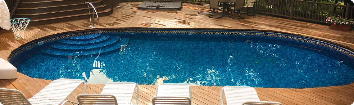Optimum Pool installed semi-inground with wooden deck