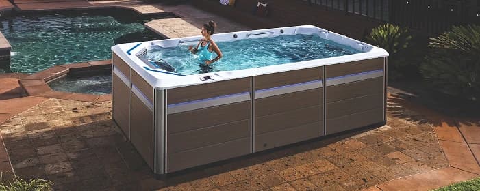 A person using an Endless Pools swim spa